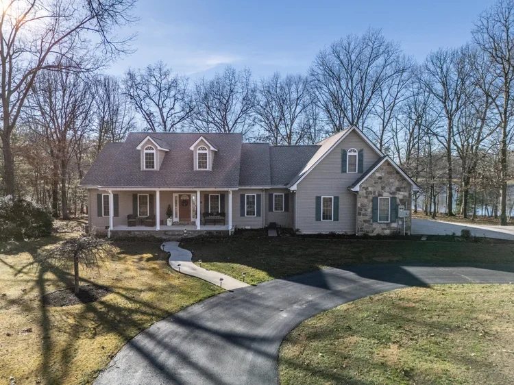 New roof installation in progress on a Tennessee home by Jeff Woods Construction and Roofing showing fresh shingles and roof deck