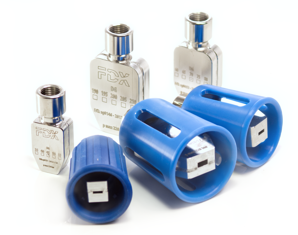 Close-up of several metal spray nozzles with engraved markings and blue plastic guard covers, displayed on a white background.