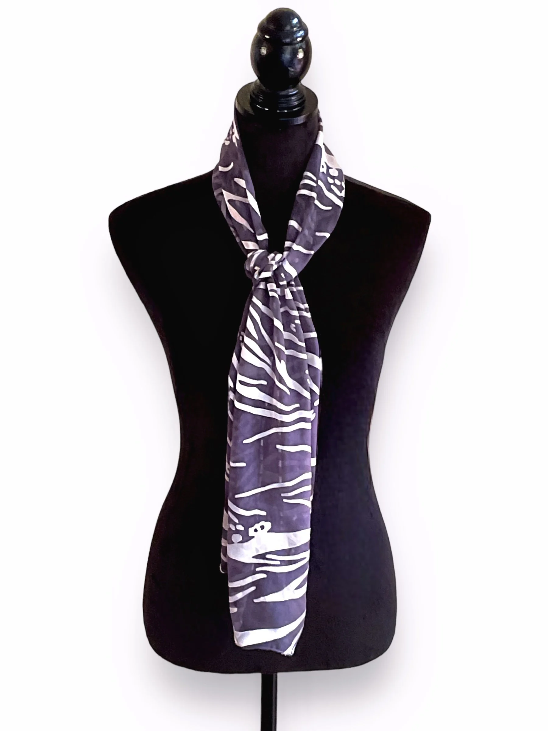 Alter Ego Dyed 100 Silk Wavy Silver Water against black backing scarf tied mannequinn.jpg