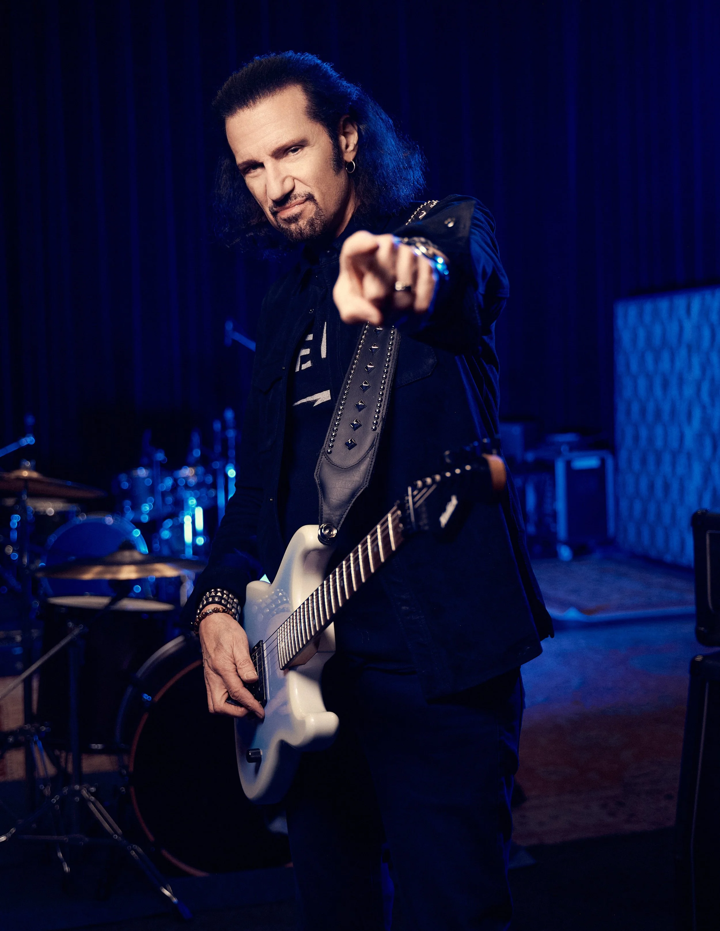 Bruce Kulick photographed in a dramatic portrait capturing his commanding presence as a rock icon