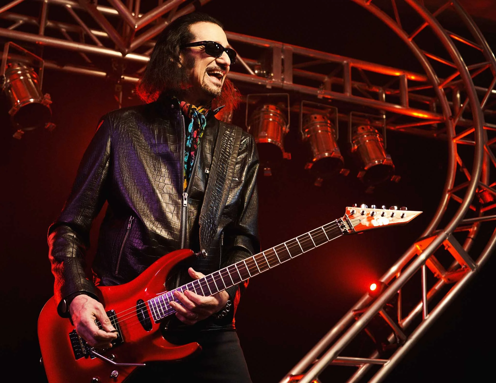 Bruce Kulick modern branding portrait with guitar defining his current visual identity across the internet