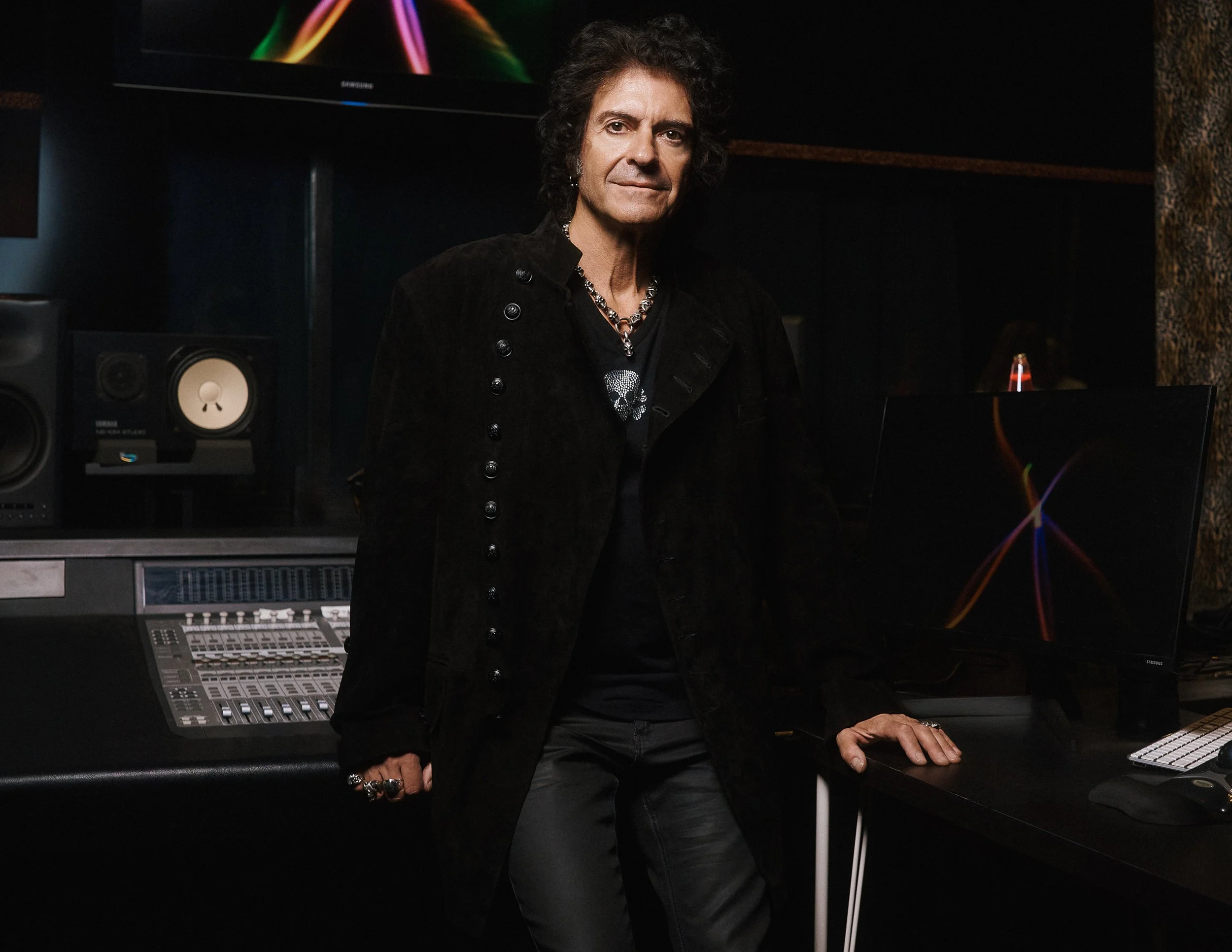 Portrait of legendary rock musician Phil Soussan photographed in a recording studio, reflecting his extensive career as a bassist, songwriter, and recording artist.