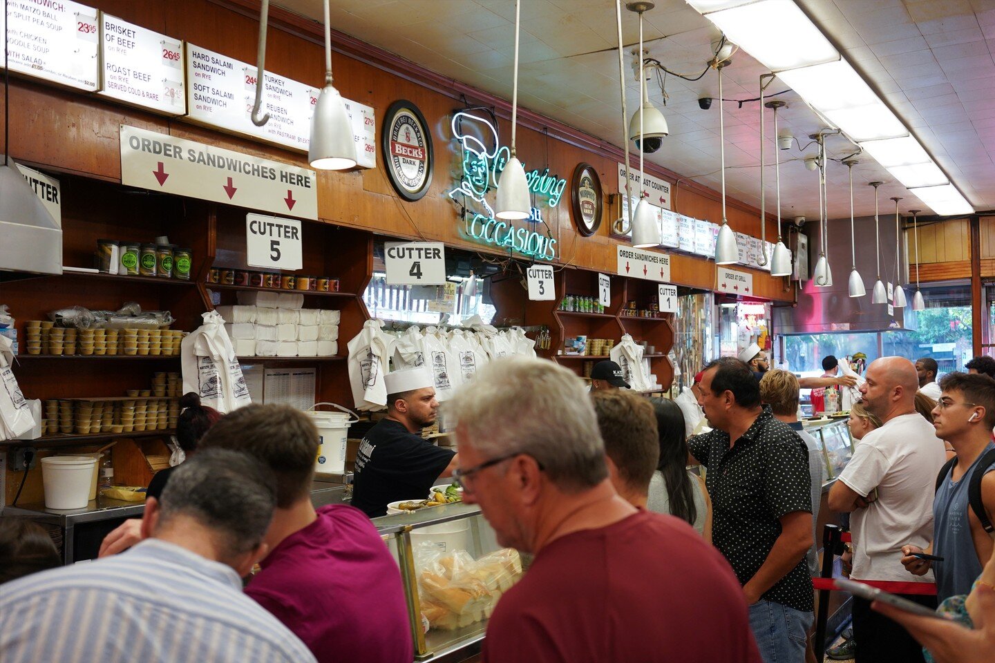 From the Life Log series on their first visit to NY.

Hungry and rushing in was Katz's in Lower East.

Founded in 1888, this delicatessen is one of the oldest in New York and is famous for its hearty pastrami sandwiches. The old-fashioned interior is