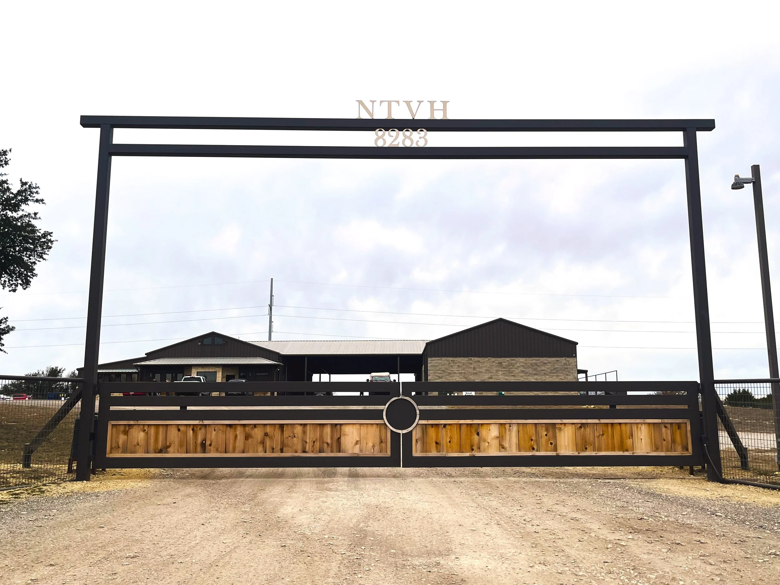 Iron-And-Cedar-Ranch-Gate-With-Iron-Header.jpg