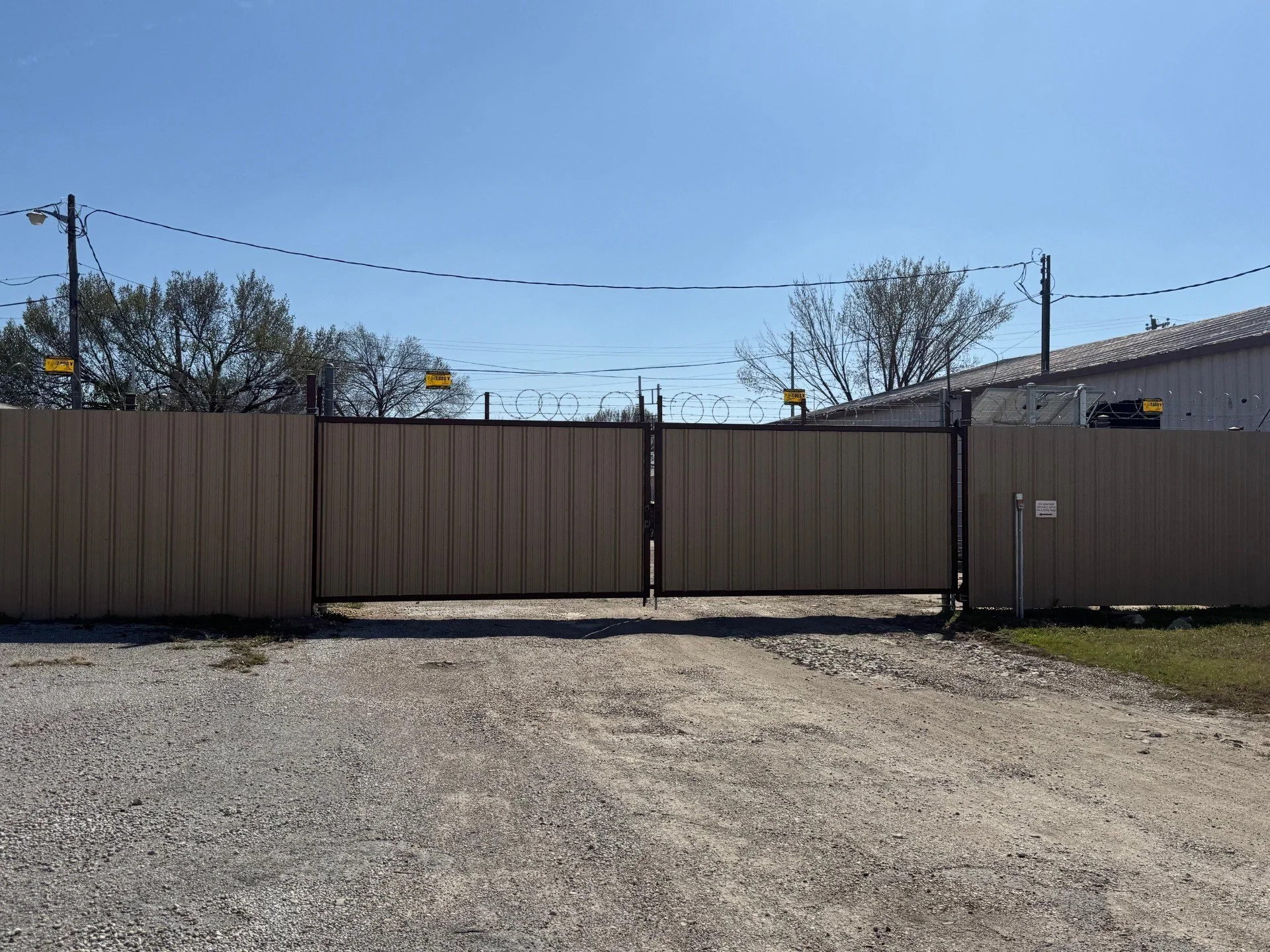 Commercial R-panel Security Fence With Razor WIre.jpg