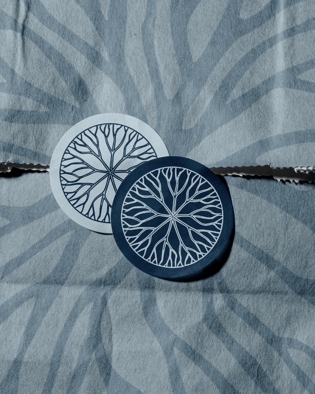 Guided by Gayle branded stickers with circular emblem placed on textured paper background