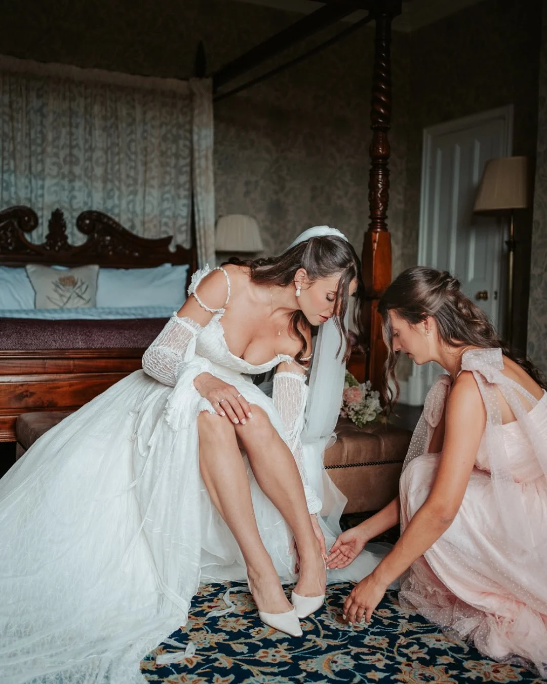 Natalie and Tom flew in from America to host this stunning old-world English wedding.

They began with private vows before stepping onto the sunlit lawns of Eastwell Manor for their ceremony. Natalie&rsquo;s gown, with its corseted waist, pearled str