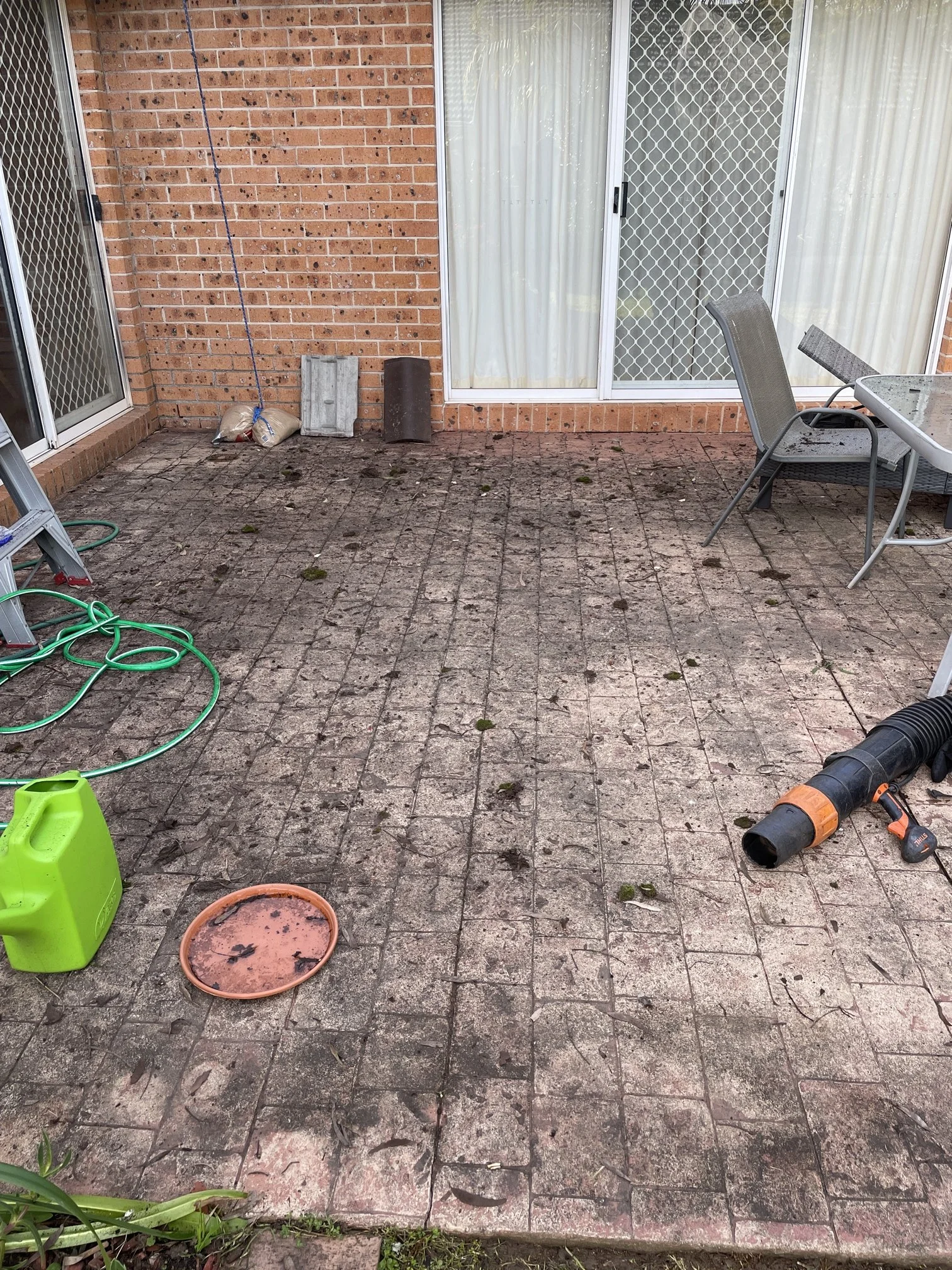 Gutter cleaners that clean up debris at ground level near me,