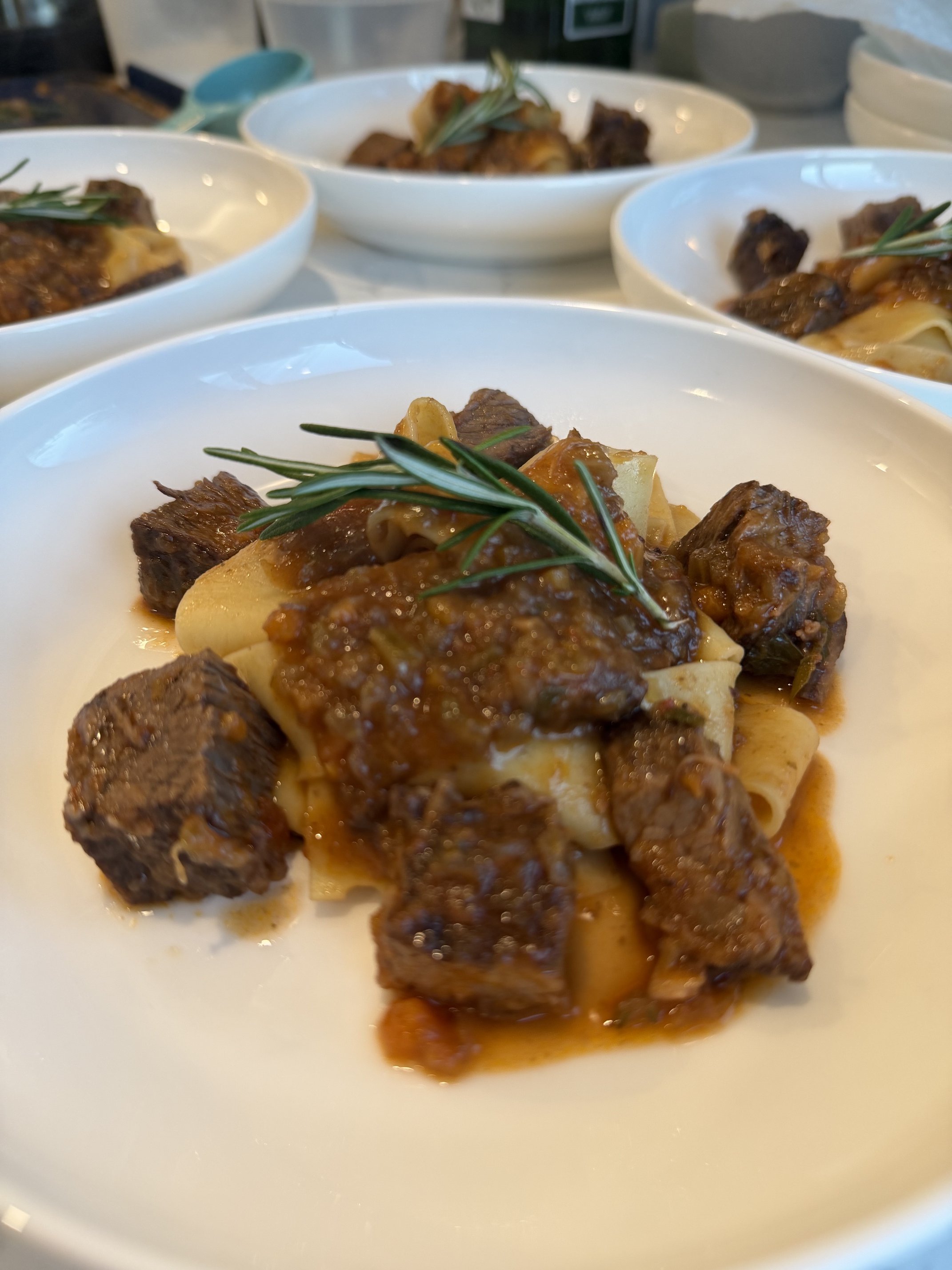 Braised beef and pappardelle plated by private chef Anthony Chiero of The Simmering Chef for an in-home dinner party in East Greenwich, RI.