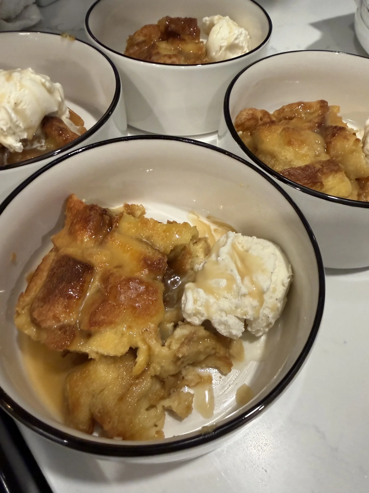bread pudding and vanilla ice cream plated by private chef Anthony Chiero of The Simmering Chef for an in-home dinner party in Newport, RI.