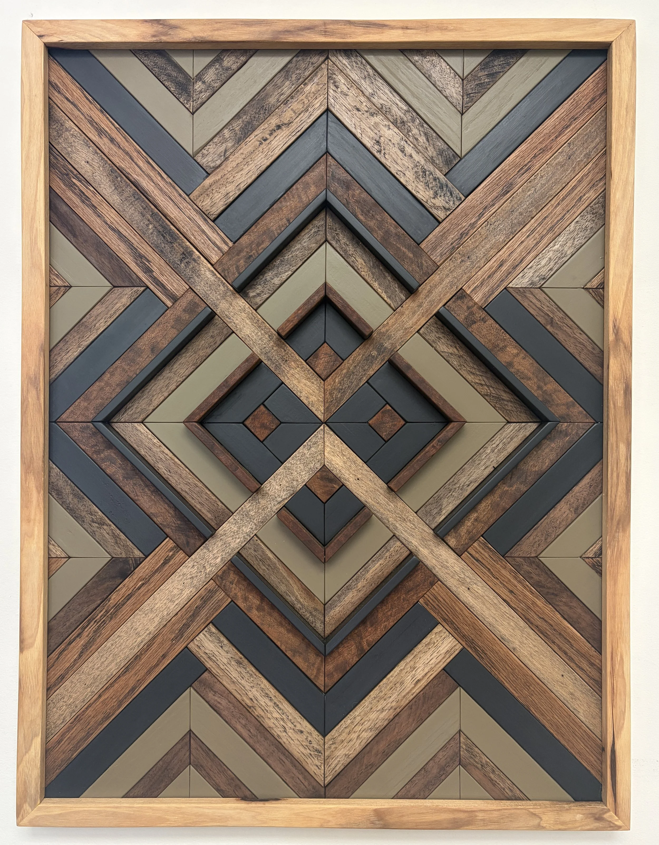 Handcrafted framed wooden mosaic in black and green paint with an espresso stains.