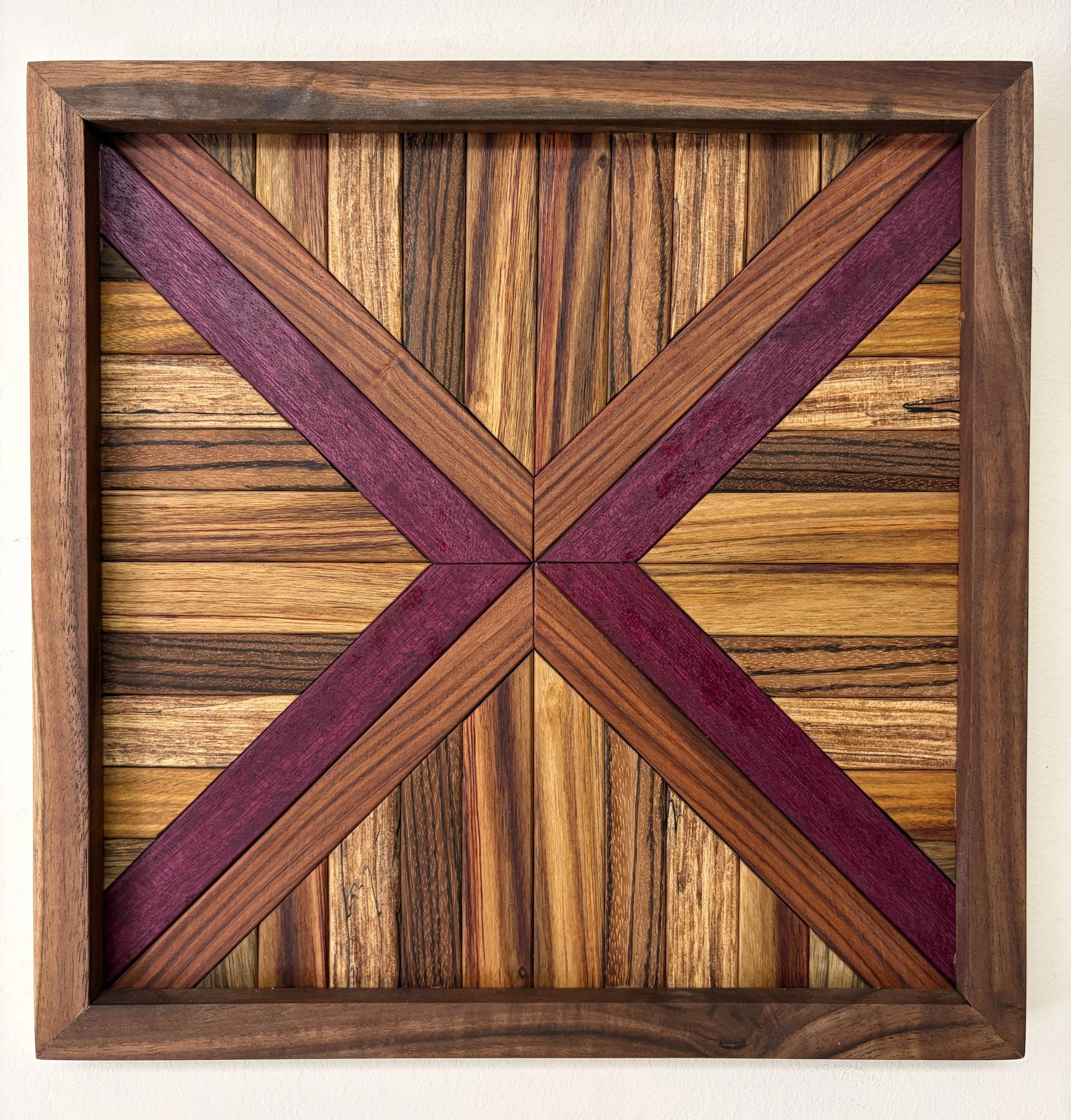 Handcrafted framed wooden mosaic made from various exotic woods.