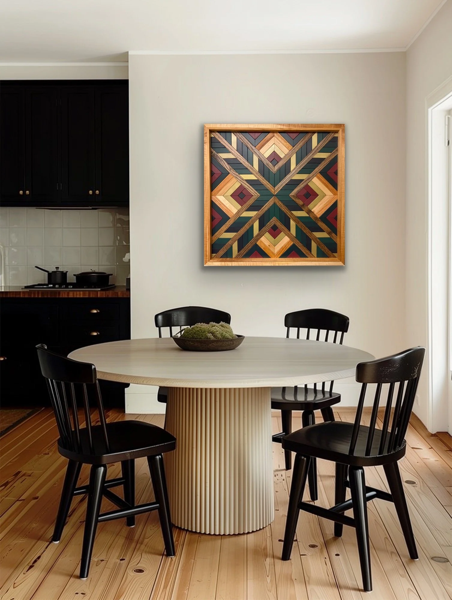 Handcrafted framed wooden mosaic in black, gold, maroon, teal, and green paint with natural and espresso stains hanging on a wall.