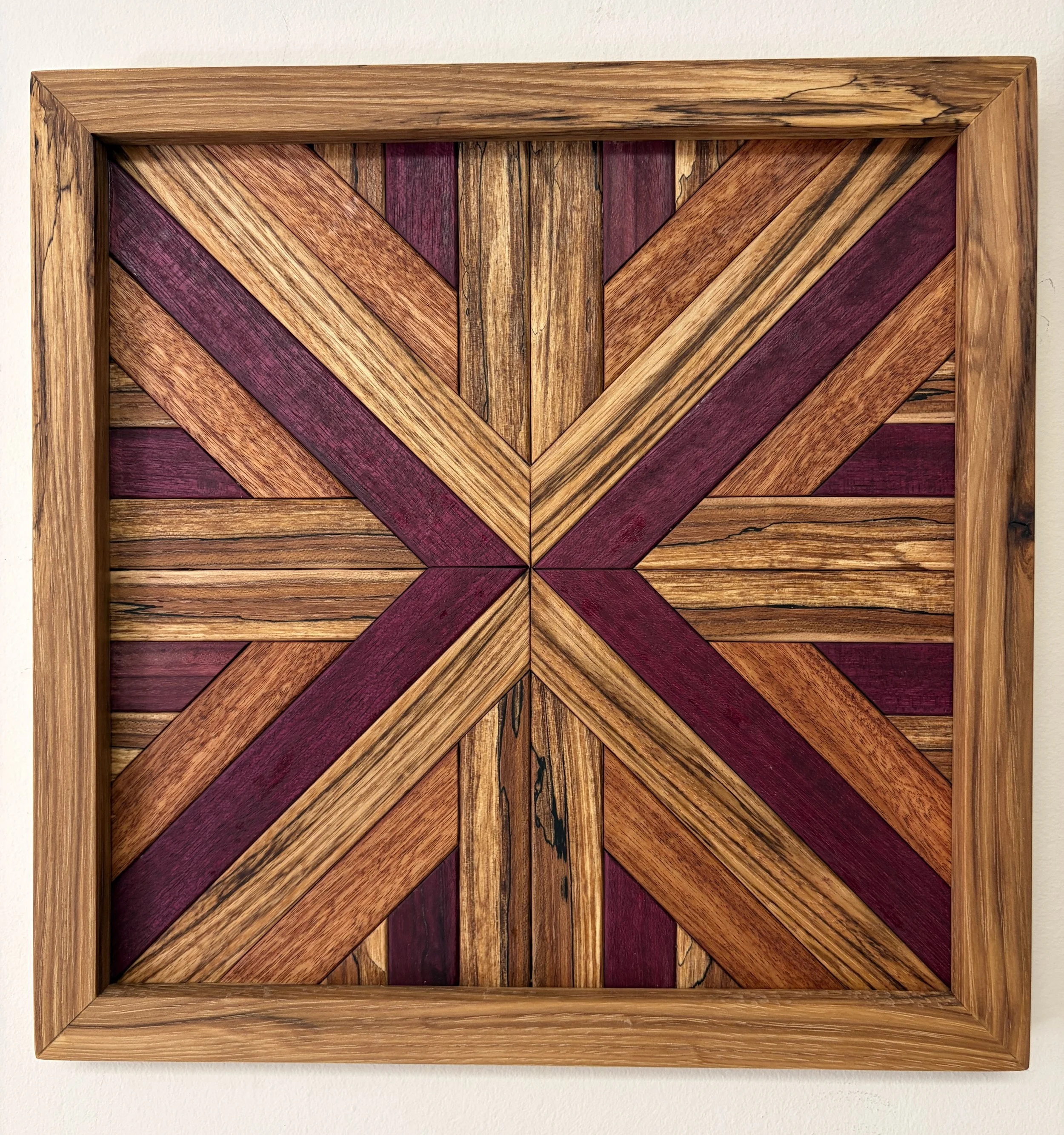 Handcrafted framed wooden mosaic made from various exotic woods.