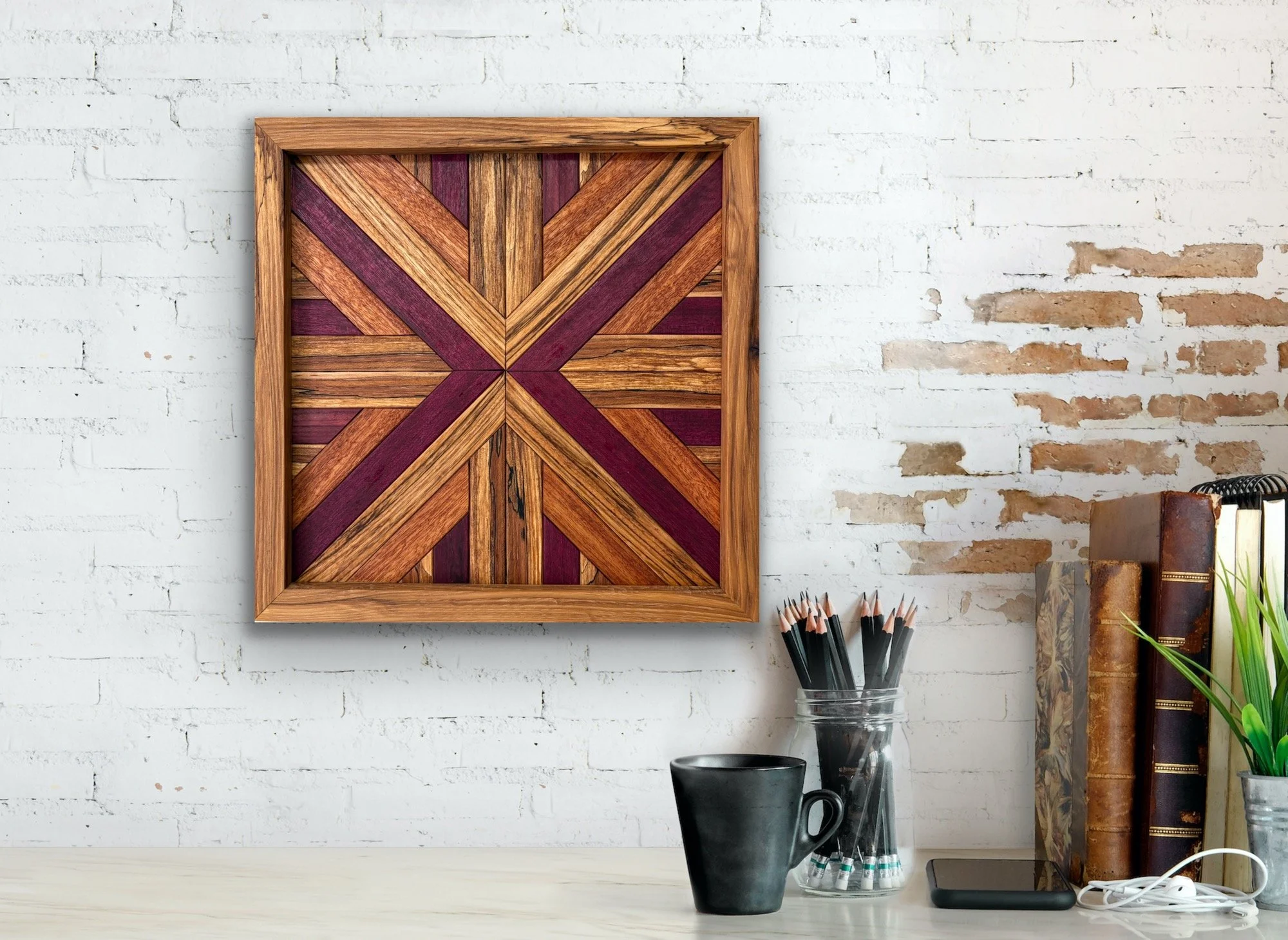Handcrafted framed wooden mosaic made from various exotic woods hanging on a wall.