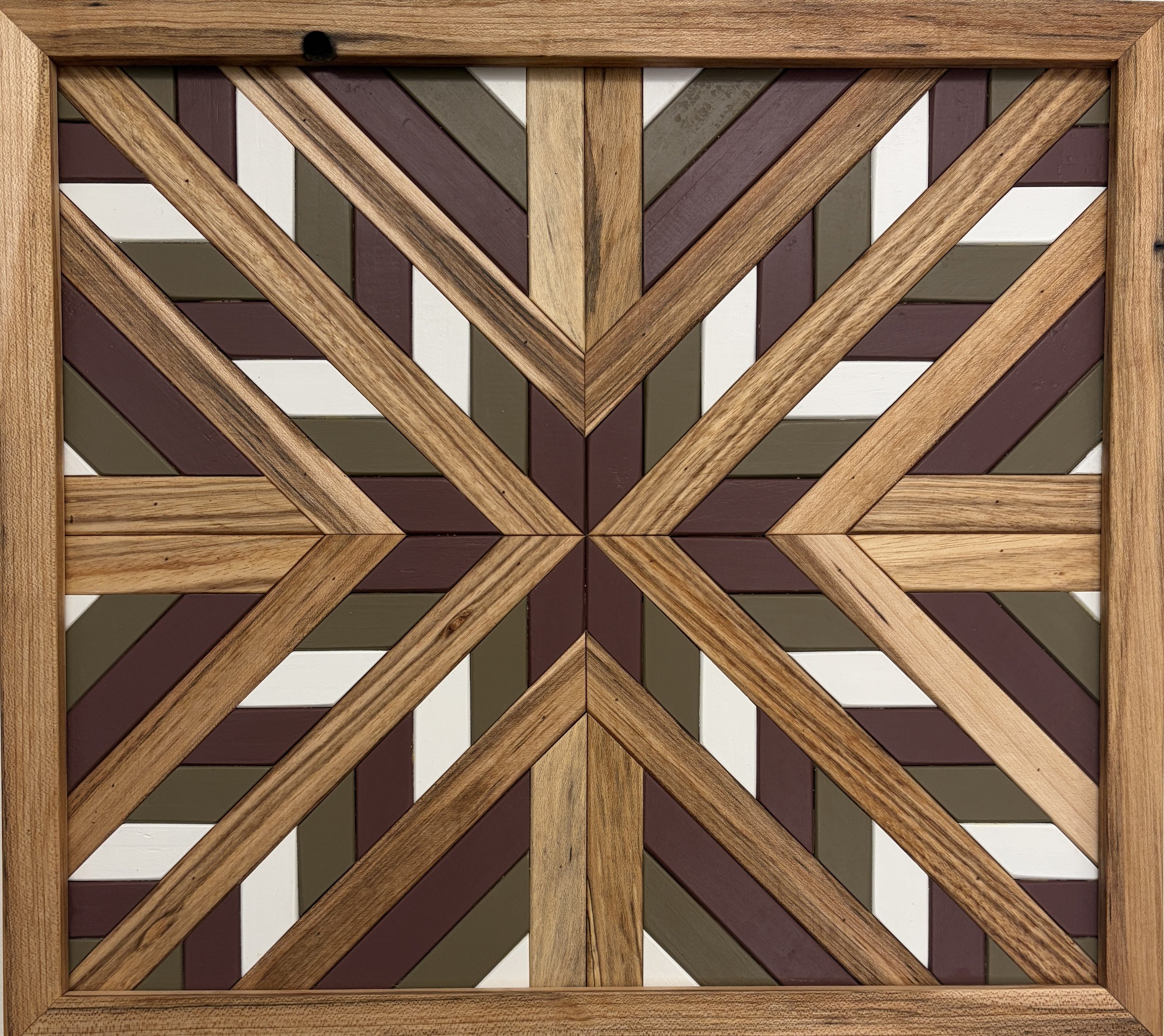 Handcrafted framed wooden mosaic in white, pink, and green paint with natural stains.