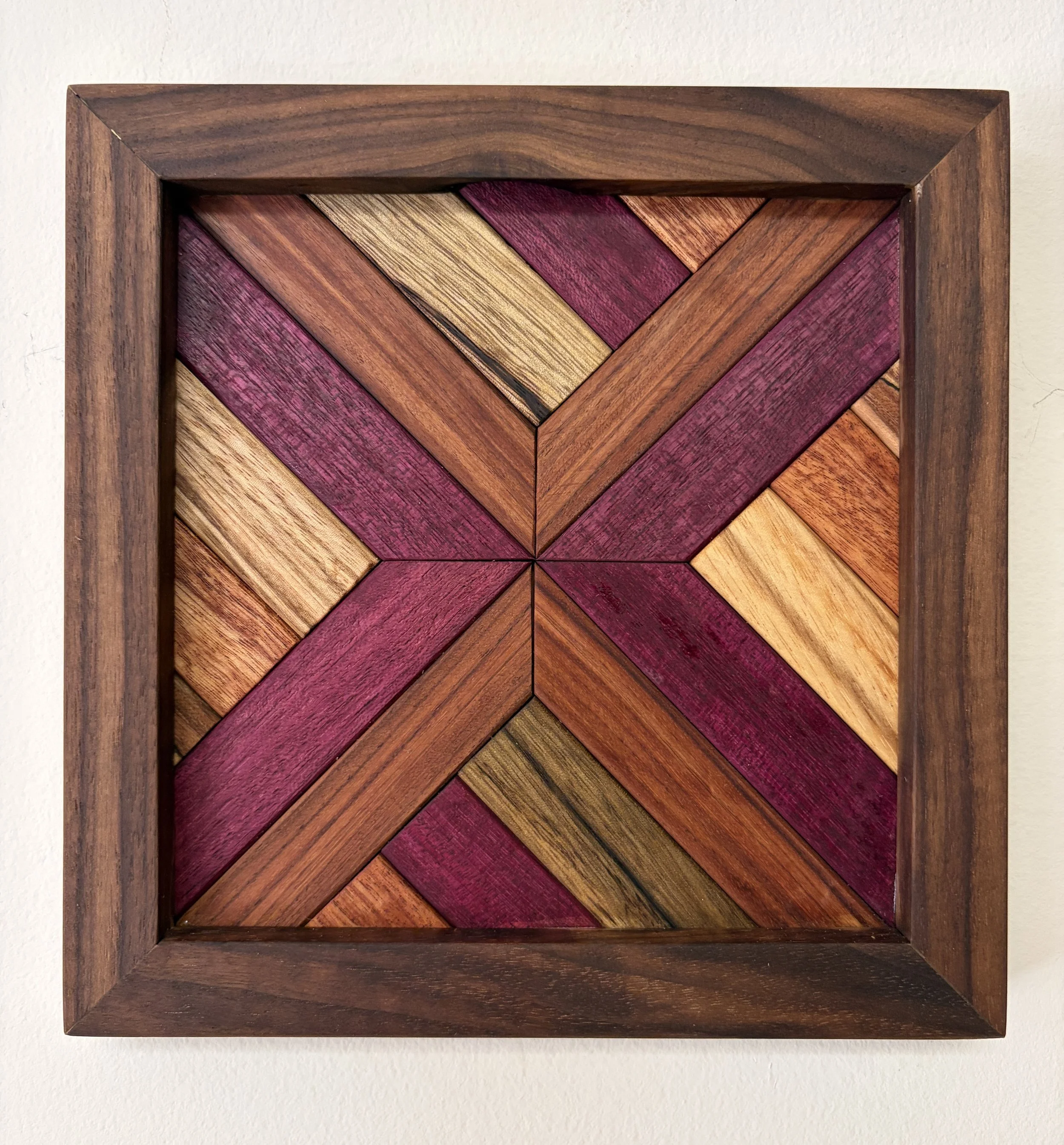 Handcrafted framed wooden mosaic made from various exotic woods.
