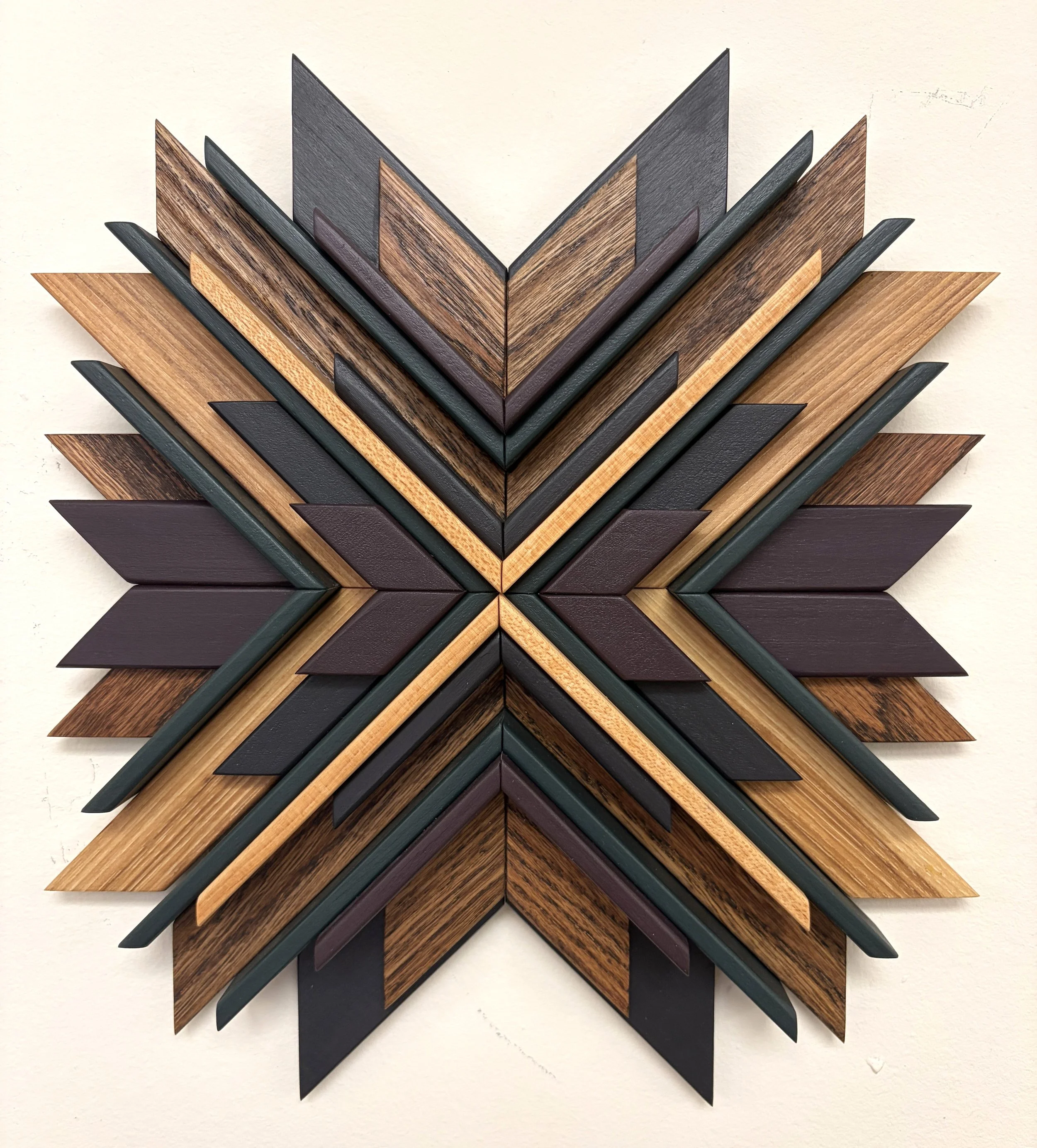 Wooden mosaic in black, purple, and green paint with natural and espresso stains.