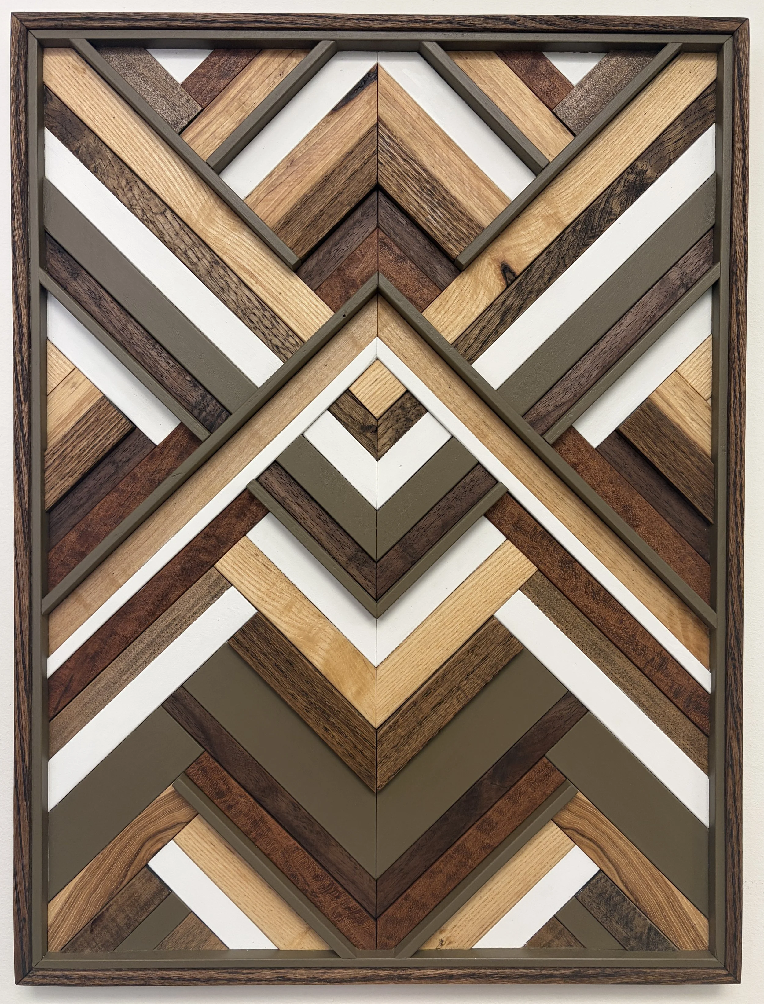 Handcrafted framed wooden mosaic in white and light olive green paint with natural, espresso, and red mahogany stains.