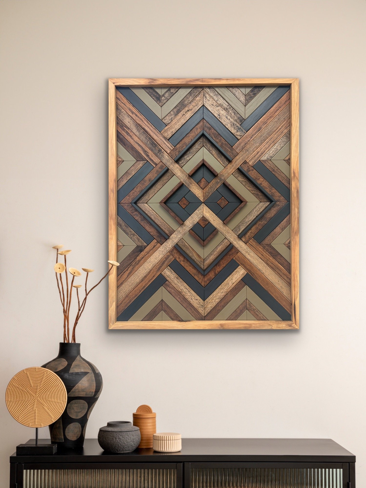 Handcrafted framed wooden mosaic in black and green paint with an espresso stains displayed on a wall.