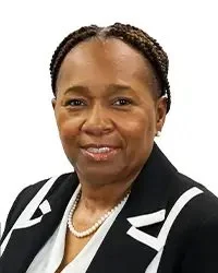 Portrait of a man in a suit with a bow tie, labeled "Vice President Mr. Kenneth L. Simmons."