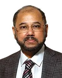 Portrait of a man smiling, wearing a blazer, with text "Commissioner Ms. Nakima Redmon" below.