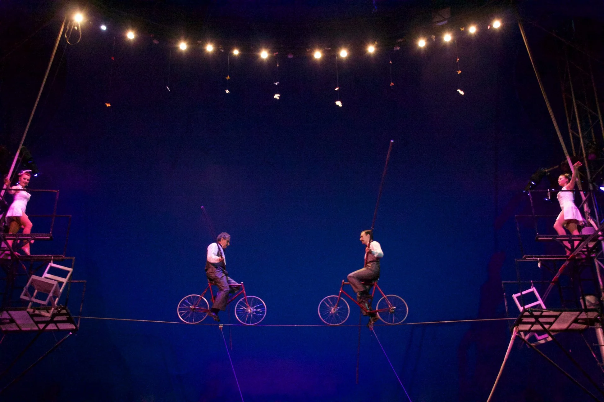 Biclycles on a tightrope at the circus