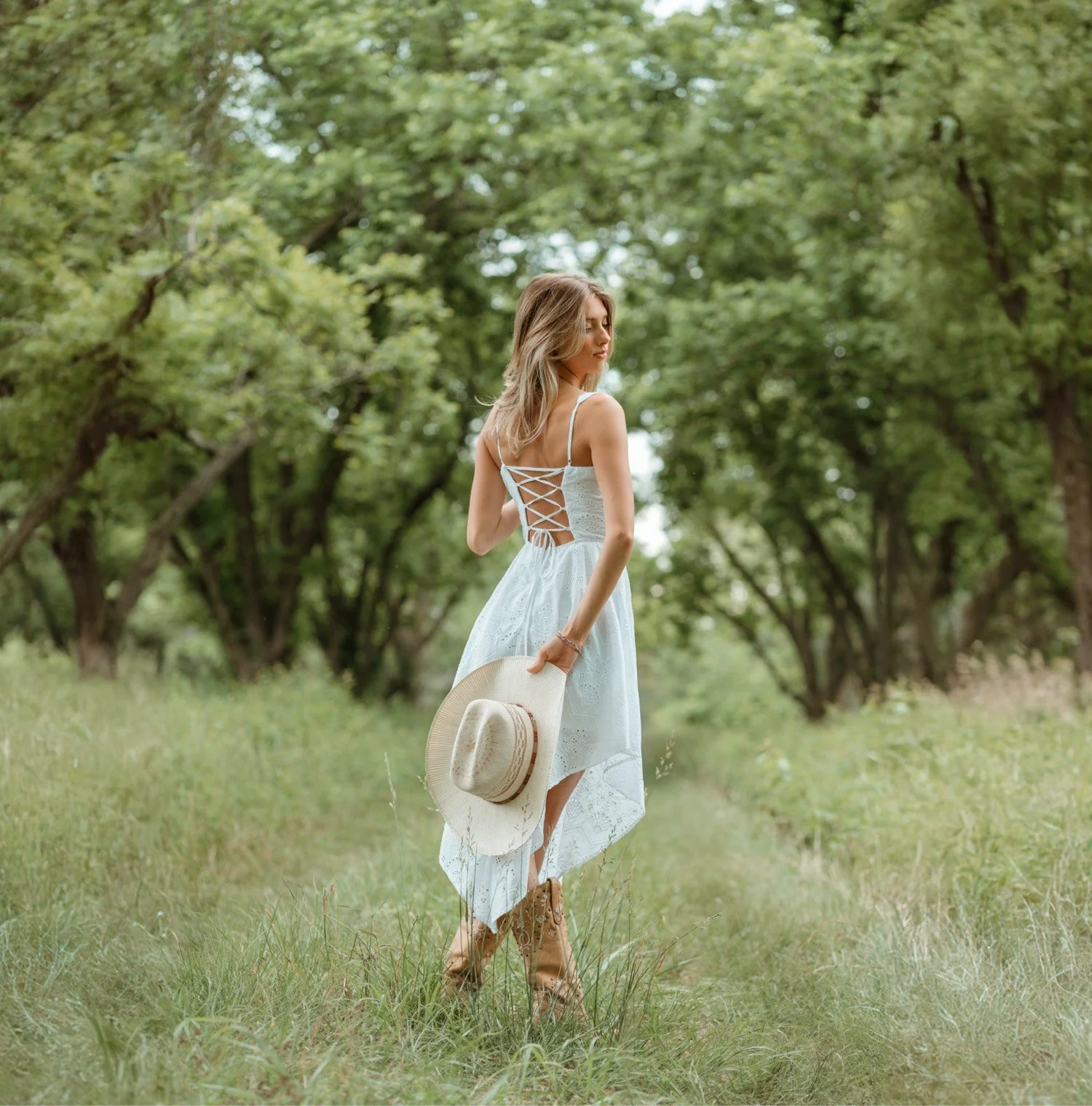 Cross one leg over the other, book in hand held behind your back, and look at me over your shoulder