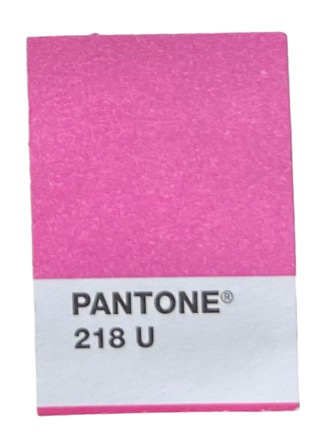 Close-up of a pink Pantone color sample labeled 218 U.