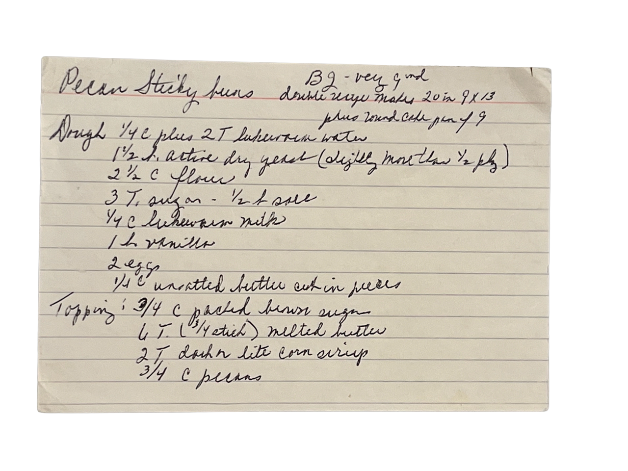 A vintage handwritten recipe for pecan sticky buns on a lined index card with ingredients and instructions.