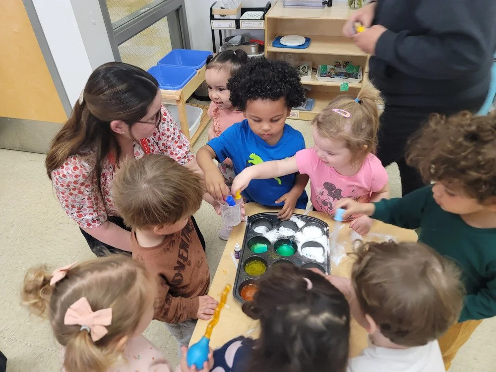 Lisandra performing science experiments with children at a daycare in Chicago