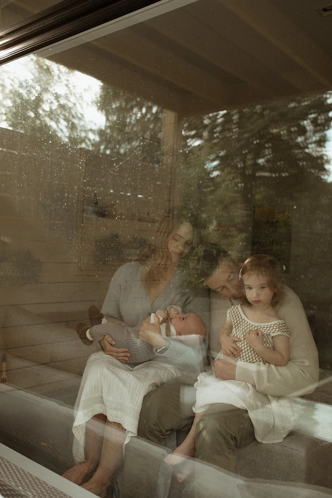family sitting in the window