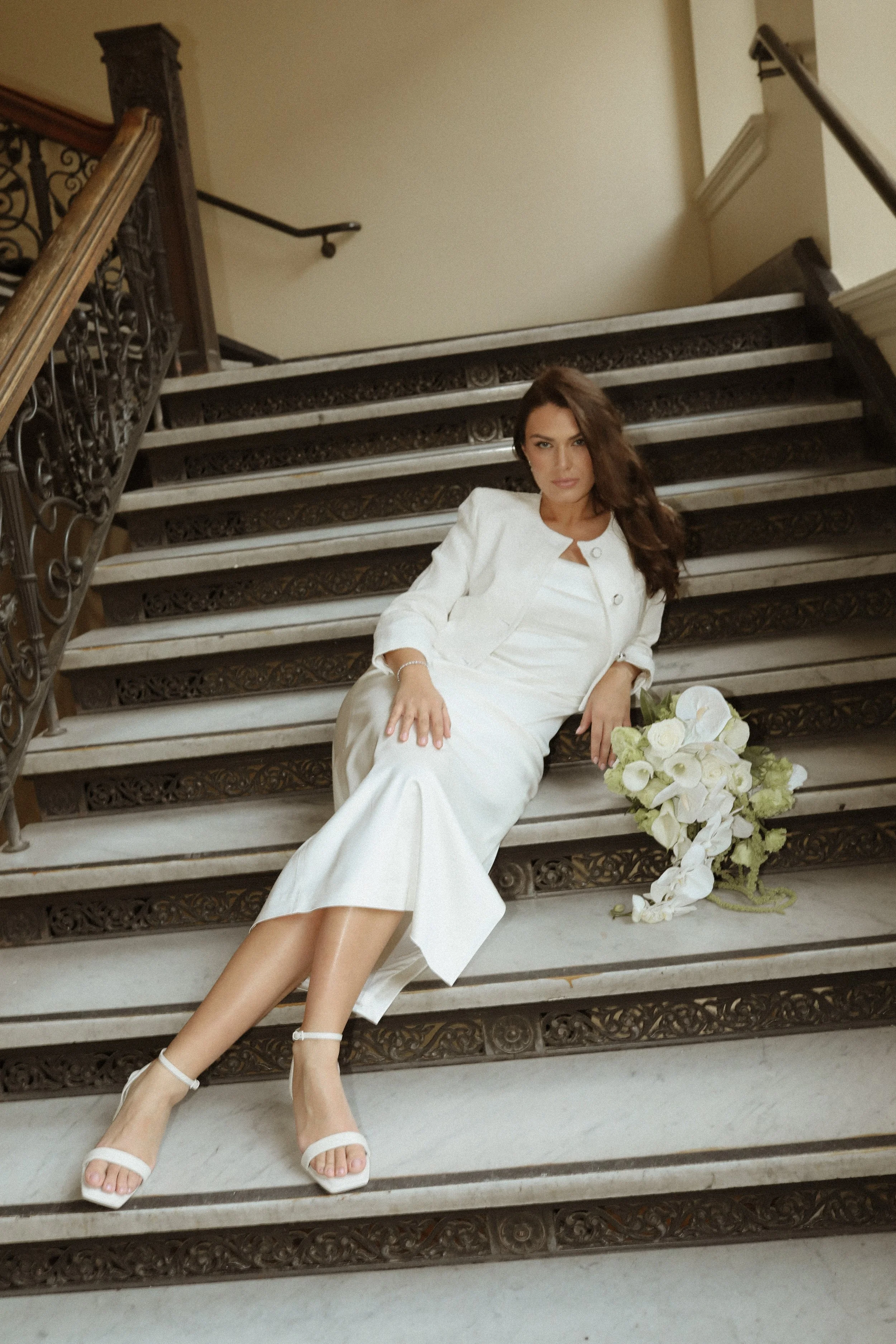 bride sitting on steps 