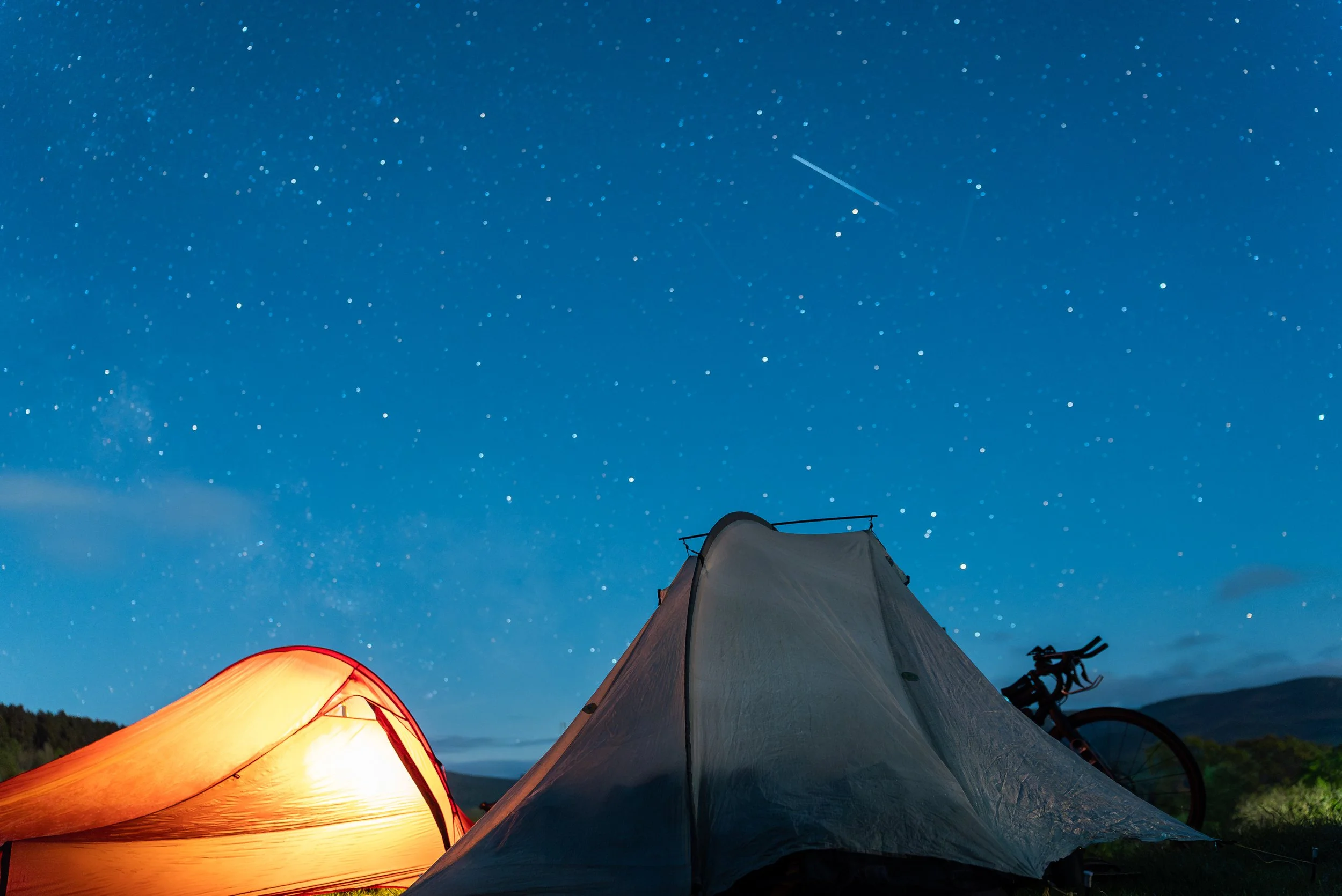 Tents under a starry night sky