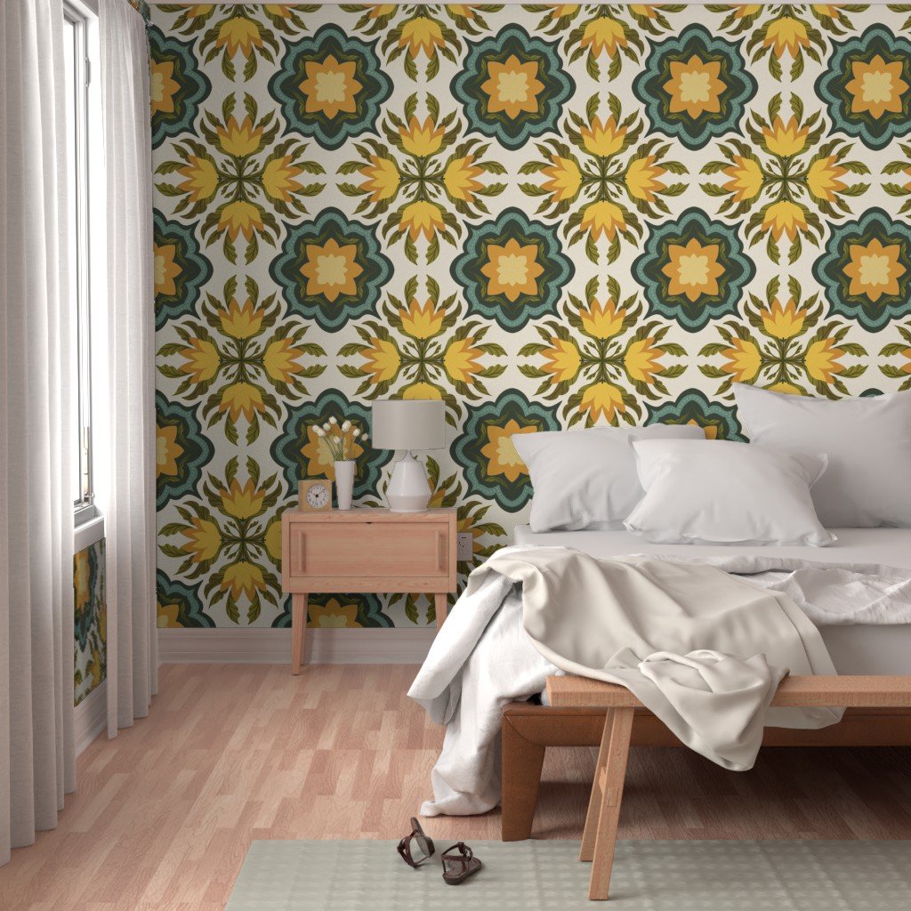 A bedroom with a large bed and white pillows, a nightstand with a lamp and clock, a pair of sunglasses on the floor, and a bright window with white curtains. The wall behind the bed has a colorful, patterned wallpaper with yellow, green, teal, and cr