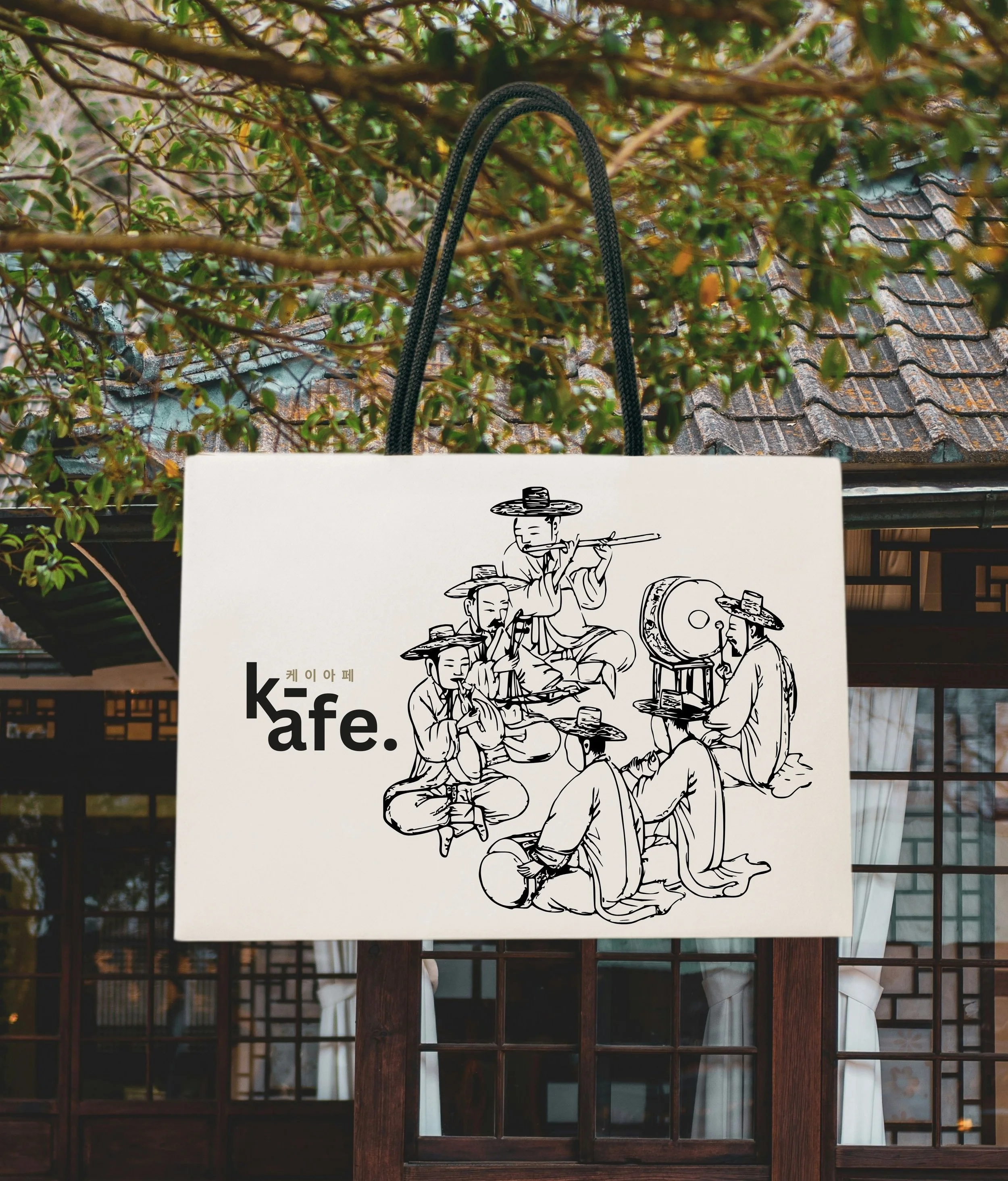 A graphic illustration on a sign depicts four people in traditional Asian attire, wearing hats, sitting around a table, playing musical instruments. The sign is hanging in front of a background with green leafy branches and a tiled roof. The text on the sign includes English words "k•fe" and Korean characters.