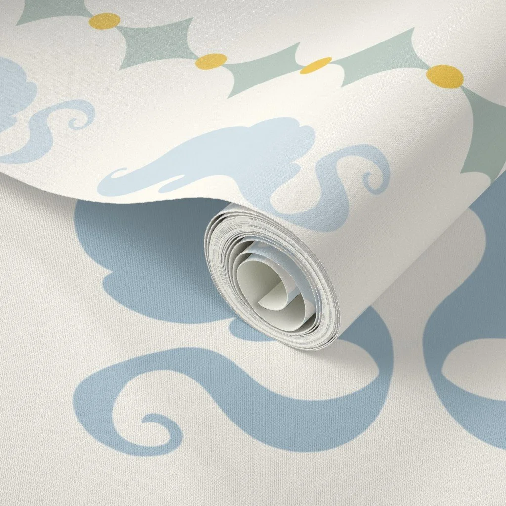 A roll of wrapping paper with a light blue and green holly and swirl pattern on a white background.