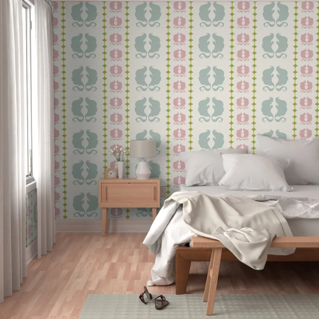 A bedroom with a wooden bed, white bedding, and pillows; a nightstand with a white lamp, a clock, and vase with flowers; curtains on a window; wallpaper with a repeating pink, blue, and green pattern.