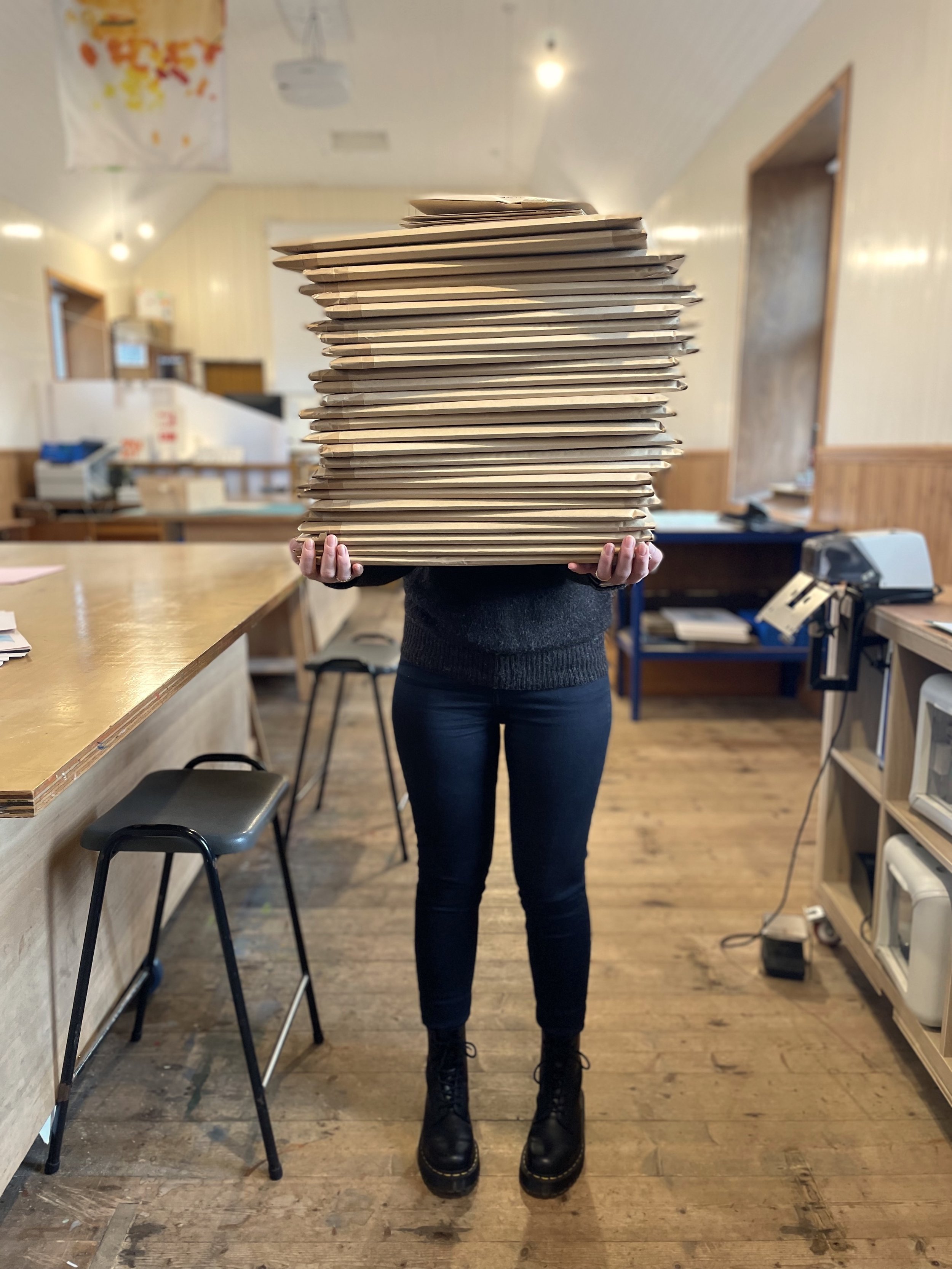  Vivian stacked high with prints ready for posting 