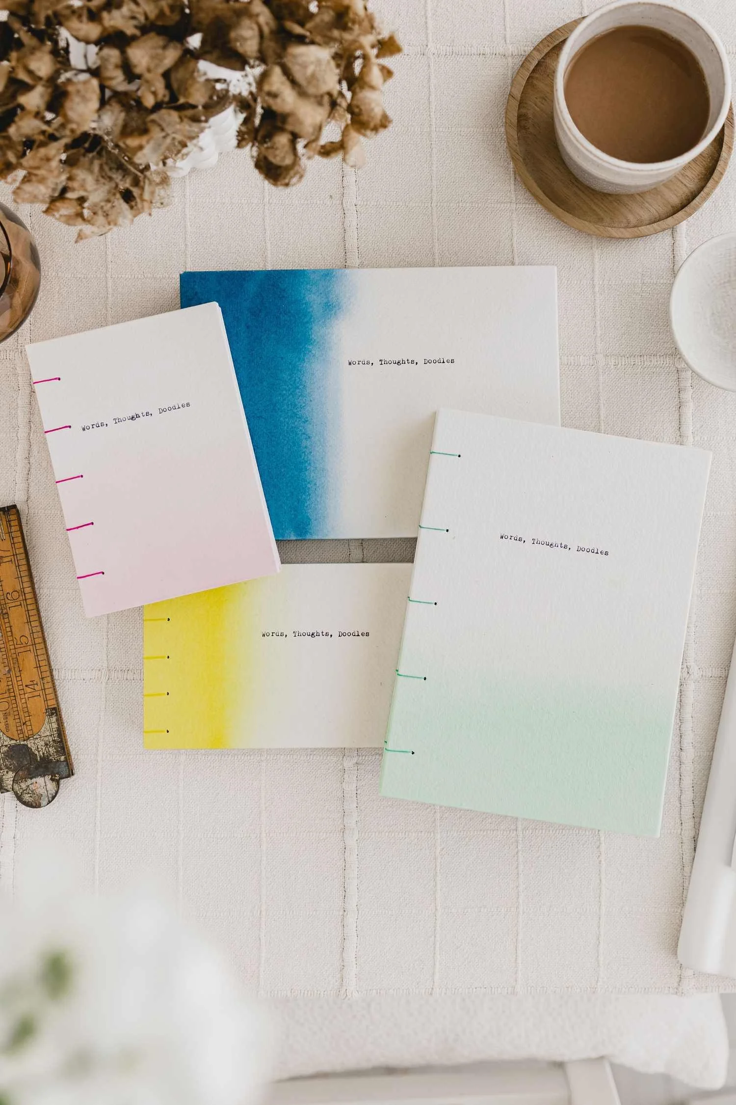 4 HARDBACK HANDSTITCHED BOOKS IN PINK, BLUE, GREEN AND YELLOW