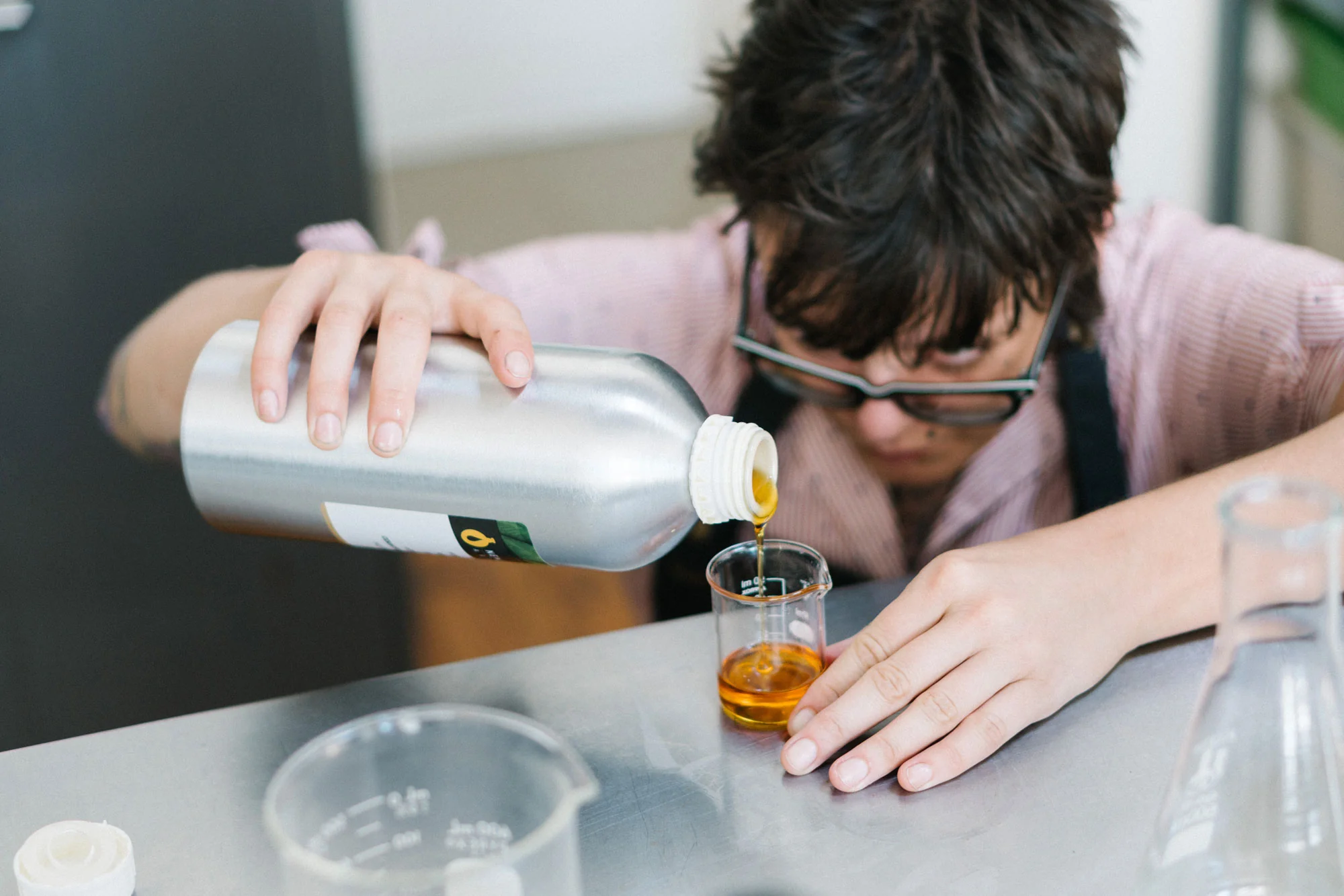  Photo of a Matter Company employee mixing liquid in a lab 