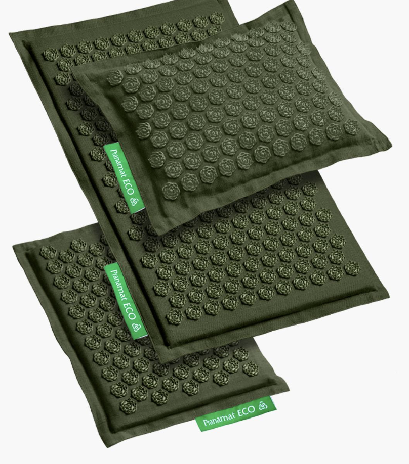 Acupressure mats and pillow set with green covers and lotus-shaped spikes, featuring "Pranamat ECO" labels.