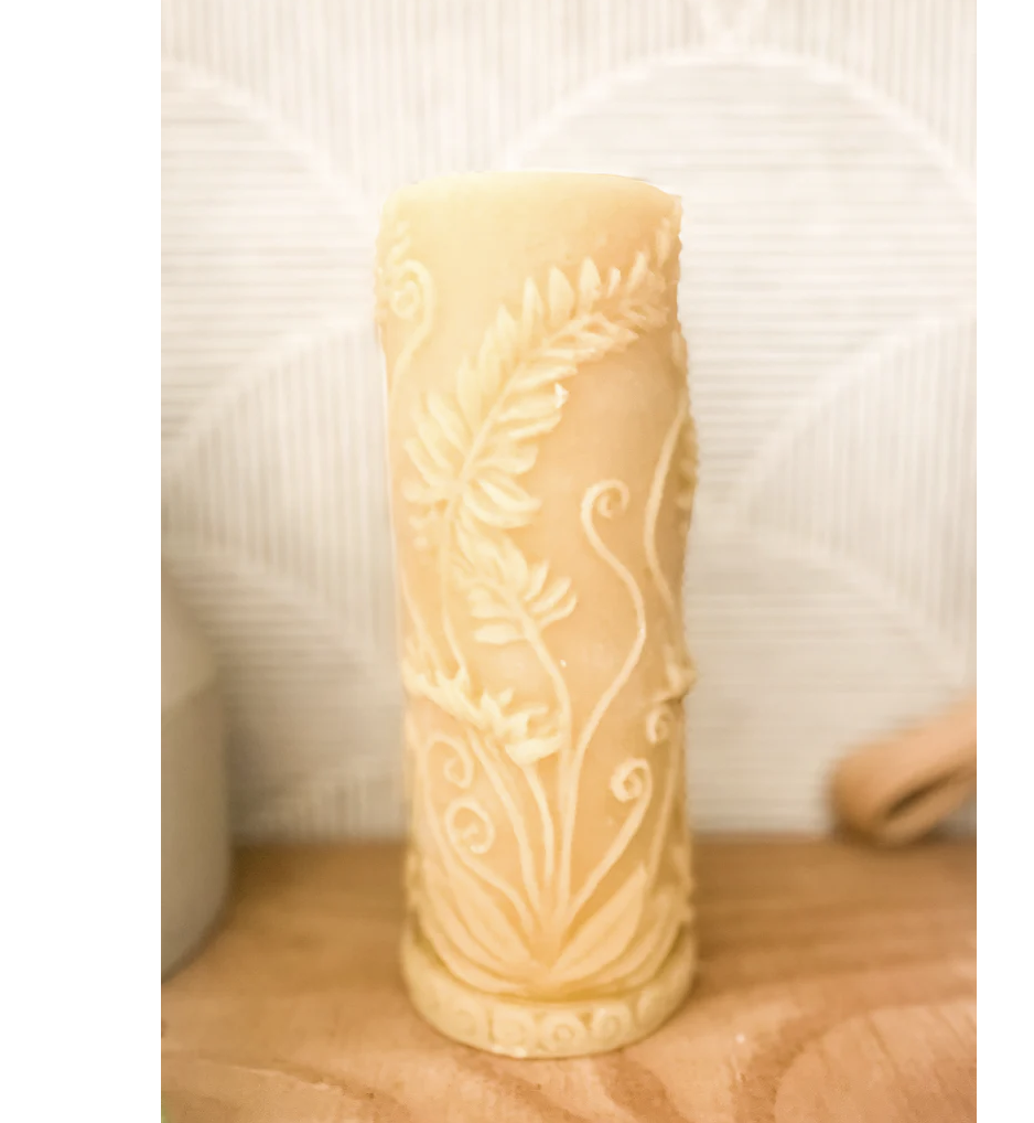 Beeswax candle with floral carvings
