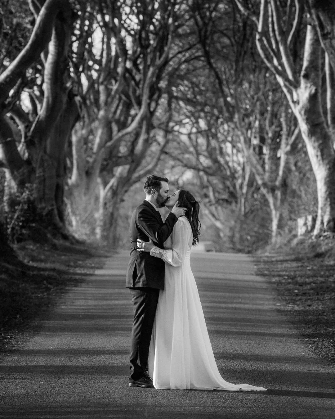 The next stop after the vows &mdash; a little stroll through the dreamy Dark Hedges with Noreen &amp; Ray. Still buzzing from the ceremony, taking it all in before heading off to the coast. Pure magic here
 #darkhedgeselopement #adventureelopementire