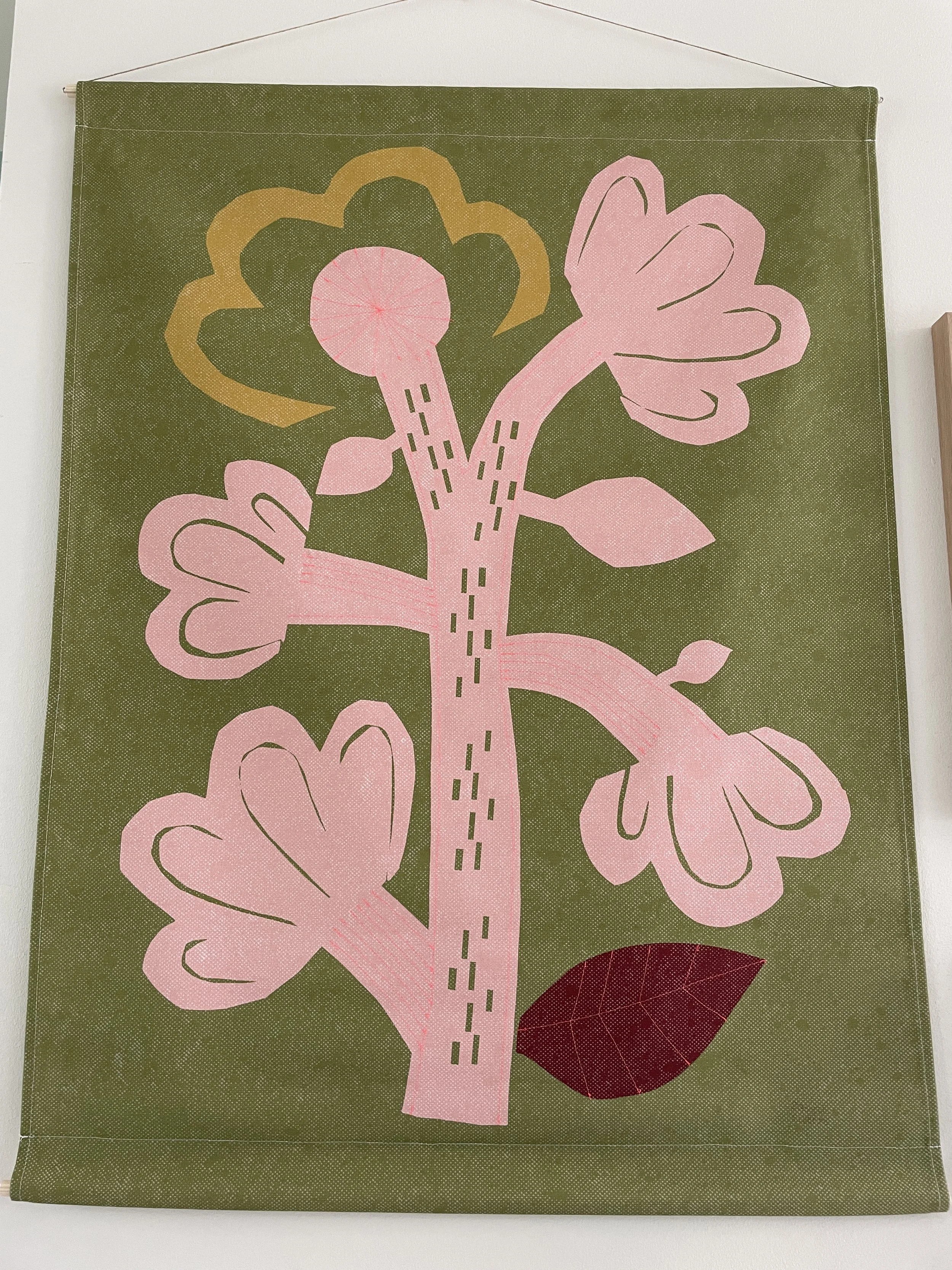 Green tapestry, pink flower with stitching, 90x120, Sabeth Elberse Studio