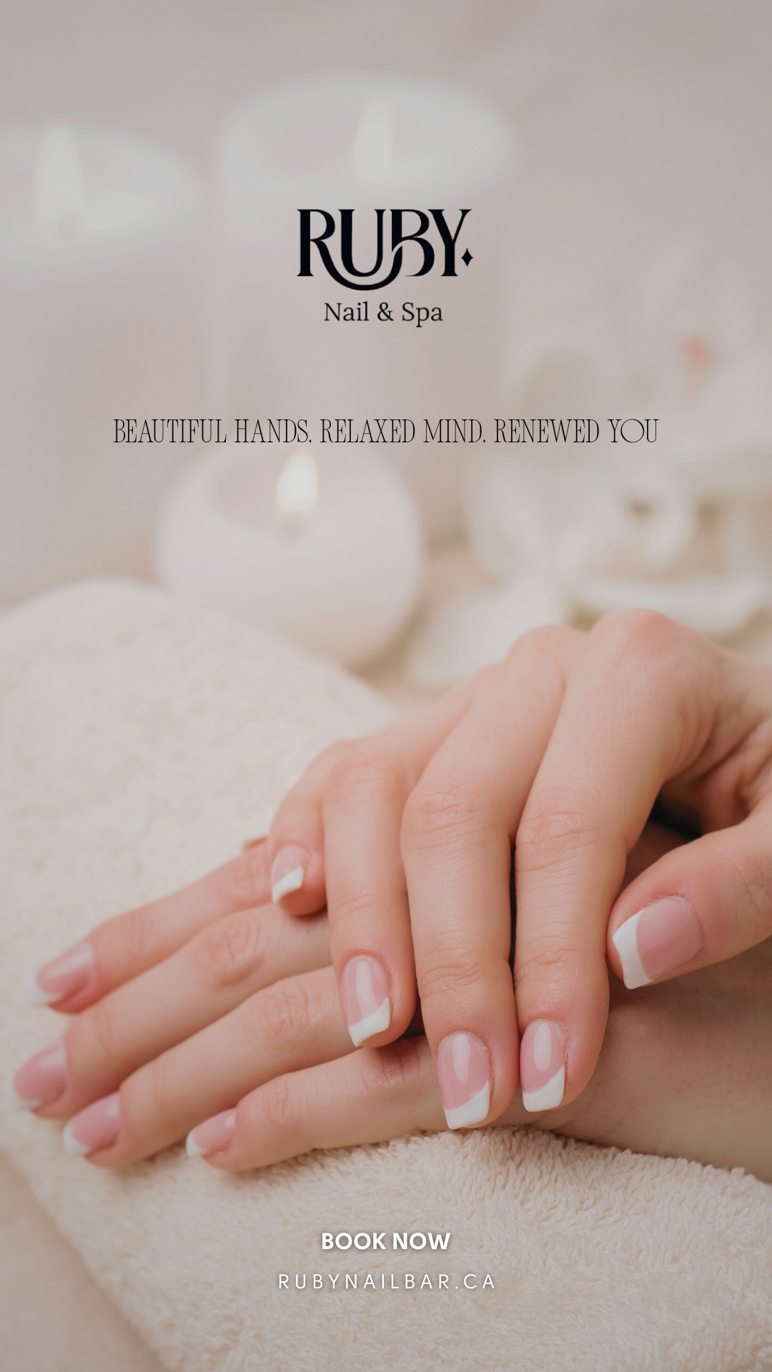 Close-up of a person's hands with neatly manicured nails resting on a soft beige surface. Background includes blurred white candles and soft lighting, evoking a relaxing spa atmosphere.