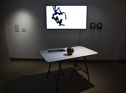 The original elements of this work were revisited for this show. The video and map table mirror each other. A bigger video monitor than previous versions.