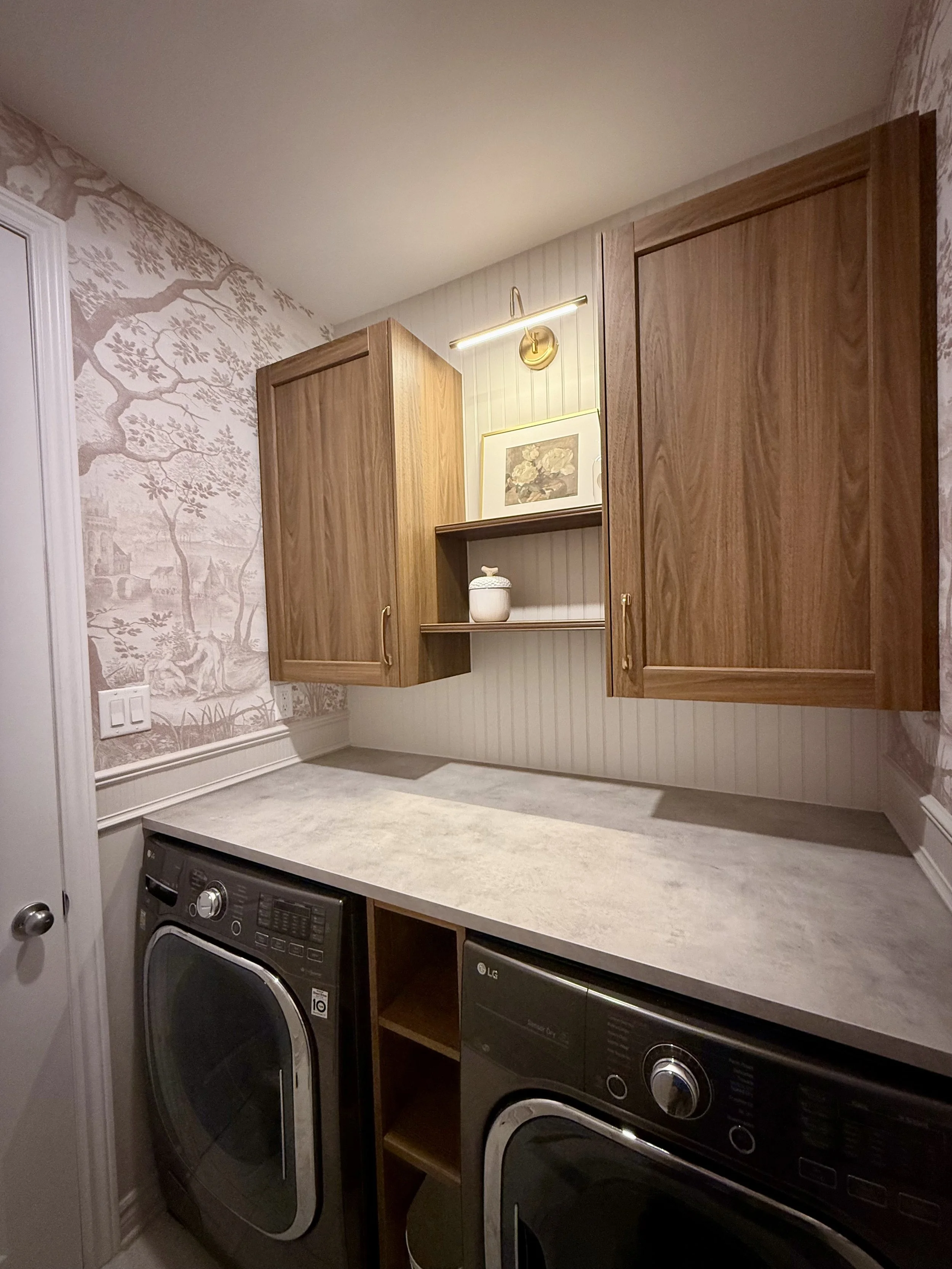 Laundry room with upper cabinets, open shelves and acent lighting