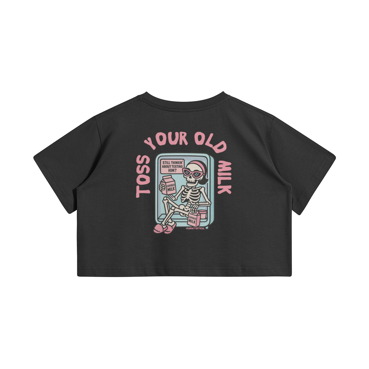Black crop top with a cartoon skeleton lounging in a fridge holding expired milk. Pink text says “Toss Your Old Milk” above the illustration.