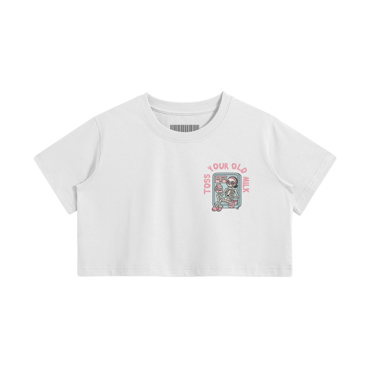 White crop top with a cartoon skeleton lounging in a fridge holding expired milk. Pink text says “Toss Your Old Milk” above the illustration.